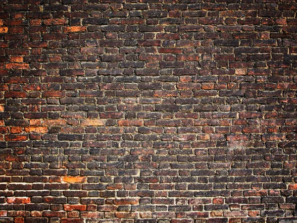 Textura de una pared de ladrillo como fondo, superficie grunge con un vin — Foto de Stock