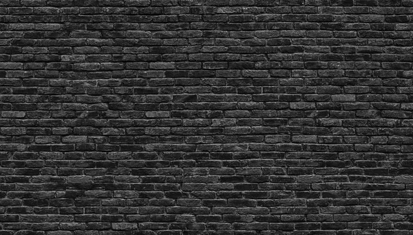Тёмная кирпичная стена, текстура черного кирпичного фона — стоковое фото