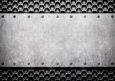 Metal plaka delikli demir arka plan üzerinde fırça