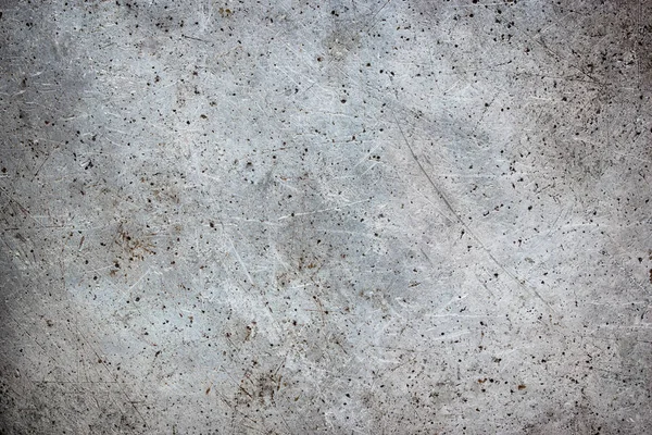 Gray metal texture in scratches and abrasions — Stock Photo, Image