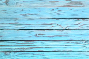 Turkuaz ve mavi renk ahşaptan yıpranmış. Boyalı ahşap doku olarak 