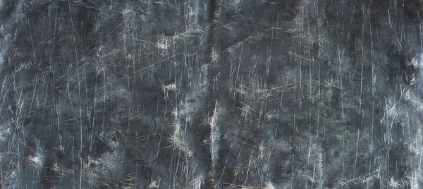 Black steel background. Old texture of crumpled metal, panoramic