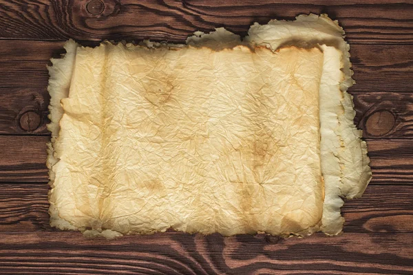 Bir ahşap masa, eski kağıt dokusu, arka plan üzerinde gelişeceğini kaydırma