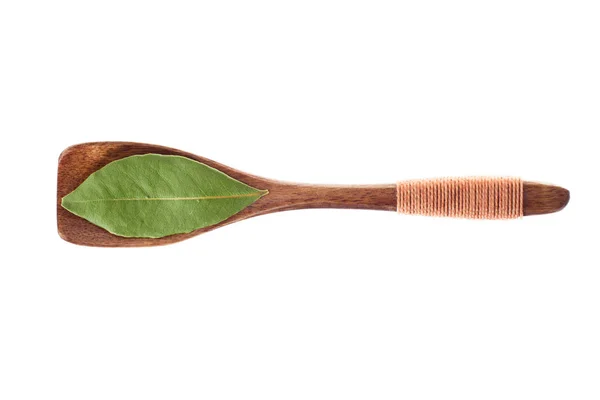 Spice dried bay leaves in  wooden spoon isolated on a white back — Stock Photo, Image