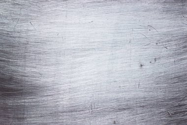 Arkaplan olarak metal yapının bir parçası olan fırçalanmış çelik dokusu
