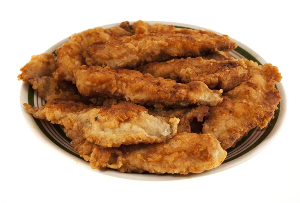 Fried fish on a plate, isolated on a white background — Stock Photo, Image