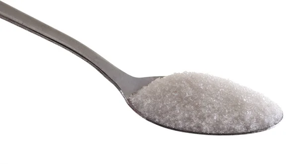 Azúcar granulado sobre una cuchara aislada sobre fondo blanco — Foto de Stock