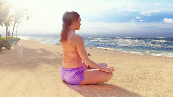 Beautiful young woman performing a spiritual yoga pose on the ocean shore at sunrise. A woman in the Lotus position is sitting on the beach. 3D Rendering