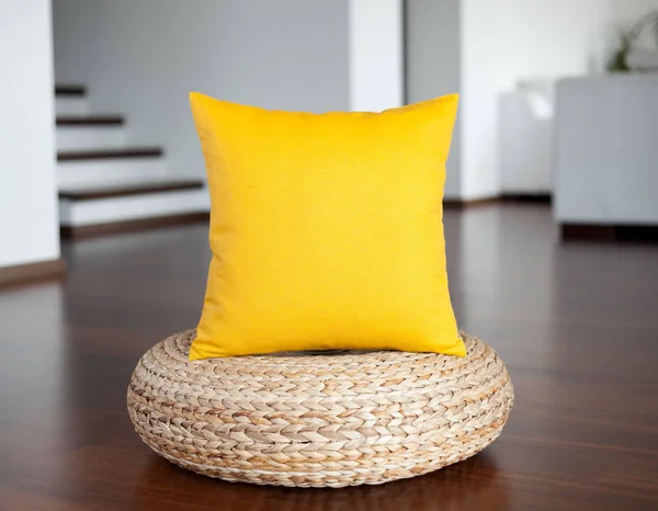 Yellow  pillow in white interior. Decorative yellow pillow in interior as bright accent.