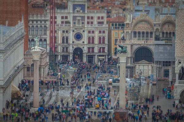 Beautiful tilt shift effect of tourists in San Marco square during high water