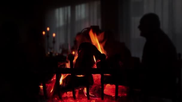 Fireplace with a glass where you can see reflected a shadow — Stockvideo