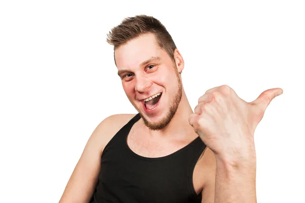 Joven barbudo chico contento vestido con camiseta negra muestra el pulgar hacia arriba, aislado sobre fondo blanco . —  Fotos de Stock