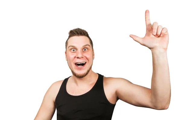 Young bearded guy with an idea in head, dressed in black t shirt shows finger up isolated on white background. Royalty Free Stock Photos