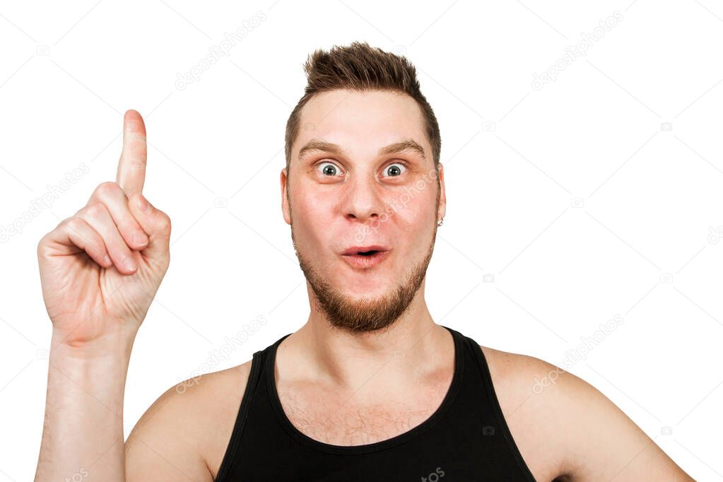 Young bearded guy with an idea in head, dressed in black t shirt shows finger up isolated on white background.