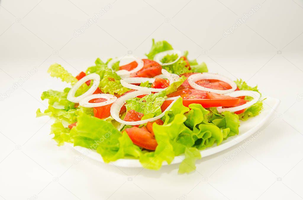 Salad on a square plate on a white background