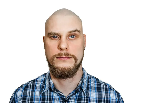 Portrait of a serious, pensive, bald guy with a beard with narrowed eyes looking at the camera on an isolated background — 스톡 사진