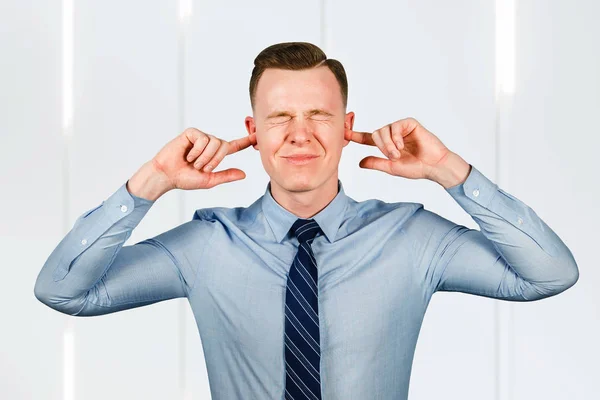 Young man businessman dressed in blue shirt and tie close his ears and eyes — Stock Photo, Image