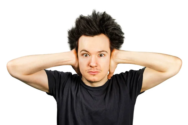 Long hair guy close his ears from the noise on a white isolated background — Stock Photo, Image