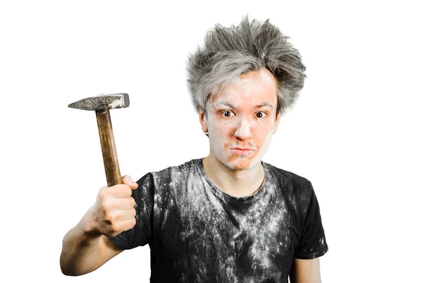 Dirty young builder guy freak in plaster is hold a hammer on isolated background at home during repairs — Stock Photo, Image