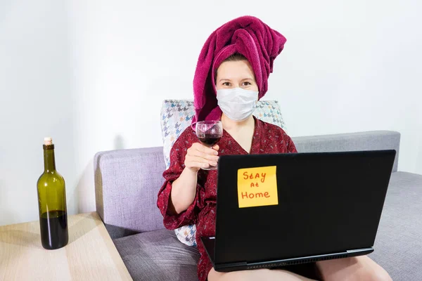 Smiling young girl video calling on laptop. Happy woman looking at computer screen watching webinar or doing video chat.