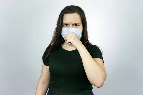 Woman cough with virus protection mask against pandemic of coronavirus COVID-19.