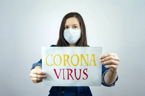 Woman holding sign Stay Home Save Lives global message coronavirus. Quarantine to fight COVID-19 pandemic.