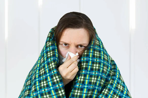 Unhealthy woman wearing medical mask, blowing nose into tissue. have flu, virus. corona virus covid-19 concept, isolated.