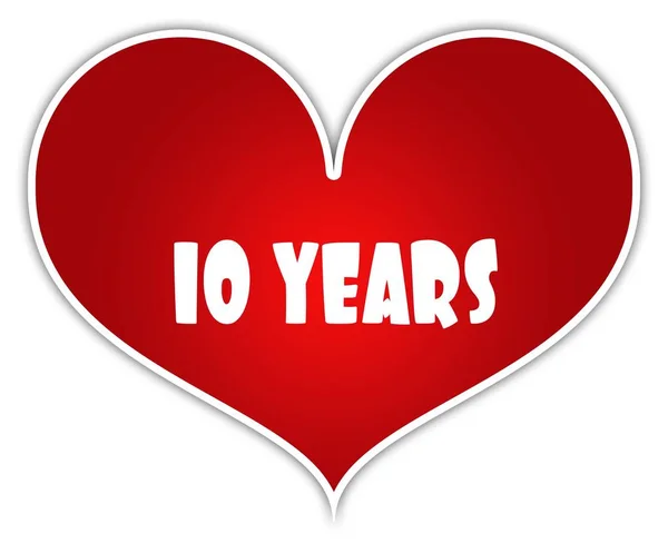 Kırmızı kalp sticker etiket üzerinde 10 yıl. — Stok fotoğraf