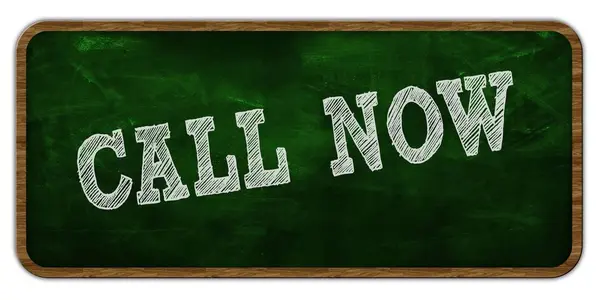 CALL NOW written with chalk on green chalkboard. Wooden frame. — Stock Photo, Image