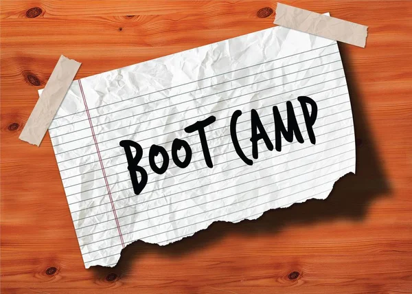 Boot Camp v rukou Roztržené stránky zmačkaný papír na dřevo textury pozadí. — Stock fotografie