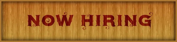 Vintage font text NOW HIRING on square wood panel background.