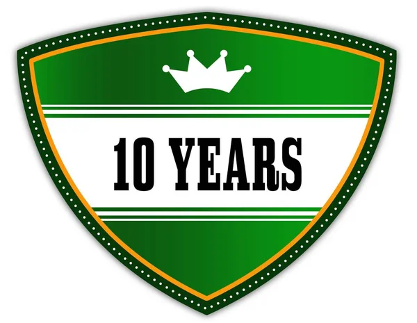 10 AÑOS escrito en escudo verde con corona . — Foto de Stock