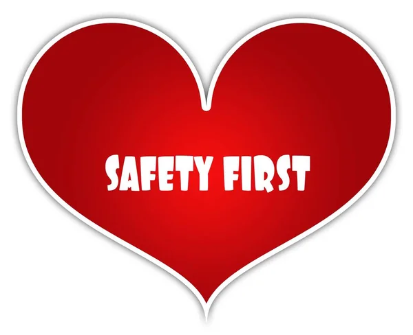 Säkerheten först på rött hjärta klistermärke etikett. — Stockfoto