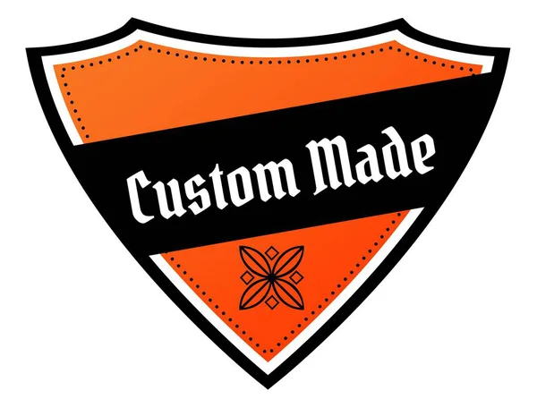 Escudo naranja y negro con texto CUSTOM MADE . —  Fotos de Stock