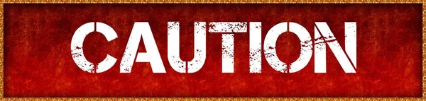 Distressed font text CAUTION on red grunge board background. — Stock Photo, Image