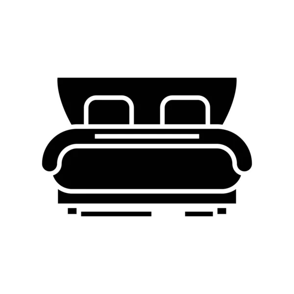 Hotel säng svart ikon, begrepp illustration, vektor platt symbol, glyf tecken. — Stock vektor