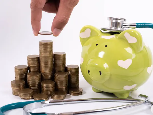 Medical insurance concept. Piggy bank, medical stethoscope and h — 스톡 사진