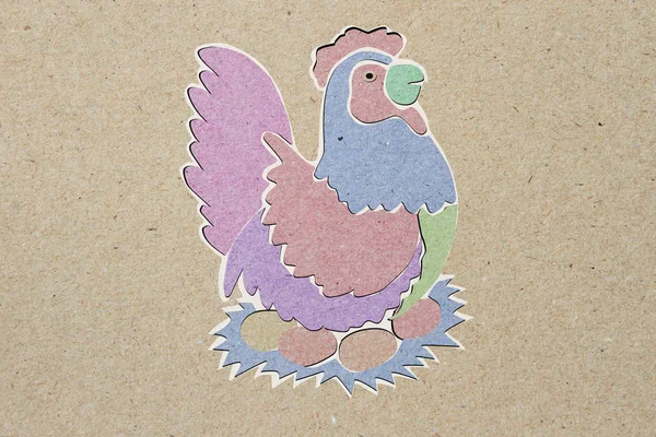 Recycled paper craft stick, chicken, brown background. — Stock Photo, Image
