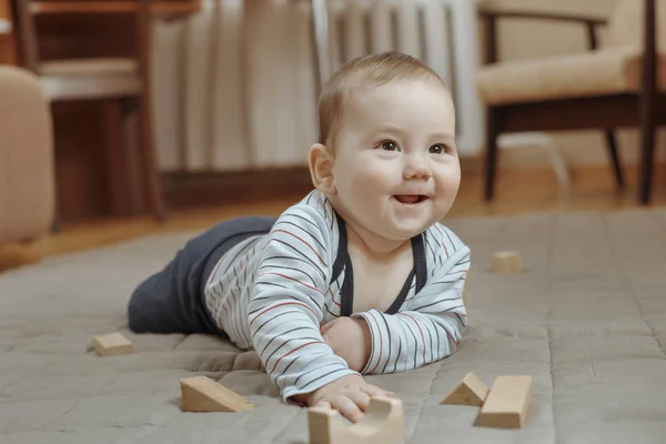 Cute happy little baby boy playing at home — Stock Photo, Image