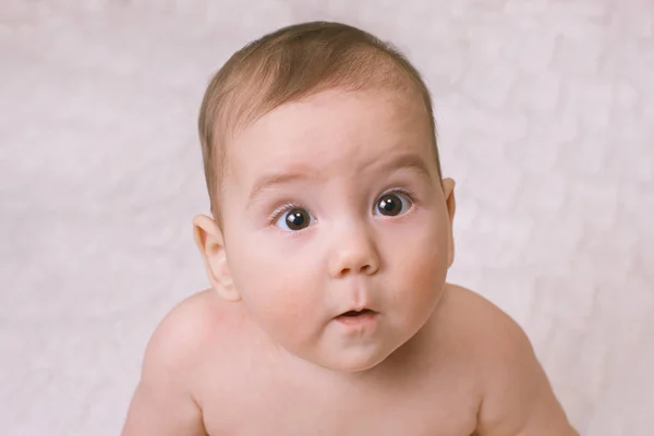 Wide eyed curious little baby — Stock Photo, Image