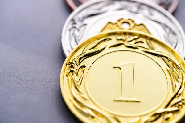 Close-up of the first three winning medals — Stock Photo, Image