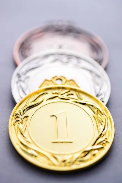 Close-up of the first three winning medals — Stock Photo, Image