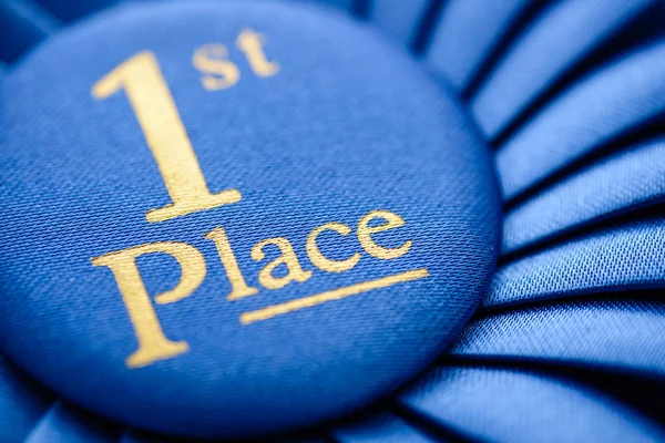 Winners blue first place rosette — Stock Photo, Image