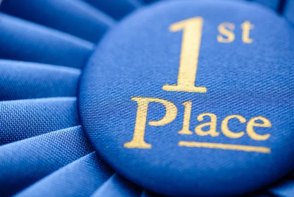 Winners blue first place rosette — Stock Photo, Image