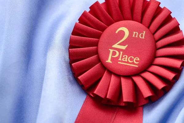 Close up of a fabric 2nd place red rosette — Stock Photo, Image