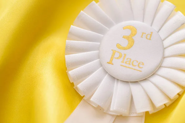 White ribbon rosette for 3rd place — Stock Photo, Image