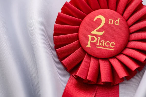 Red fabric award ribbon for the 2nd place — Stock Photo, Image