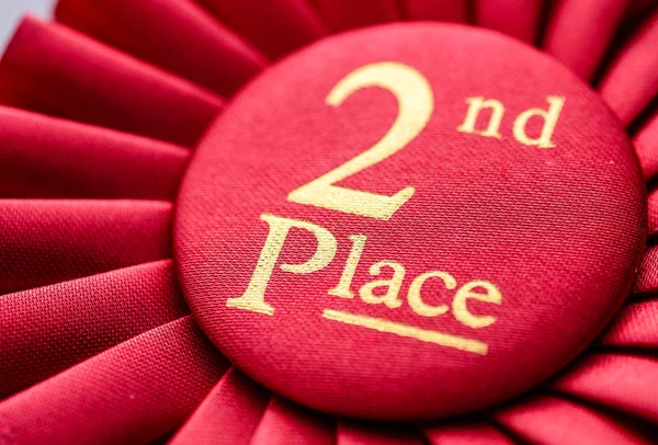 Close up of a fabric 2nd place red rosette — Stock Photo, Image