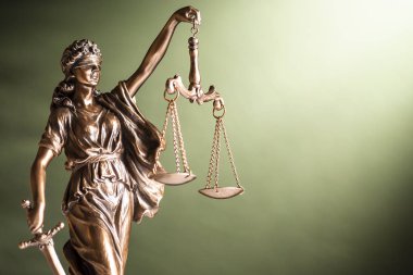 Bronze statue of Justice with sword and scales clipart