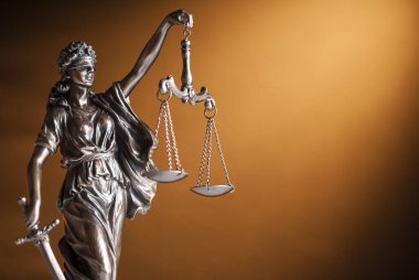 Bronze statue of Justice holding up scales clipart